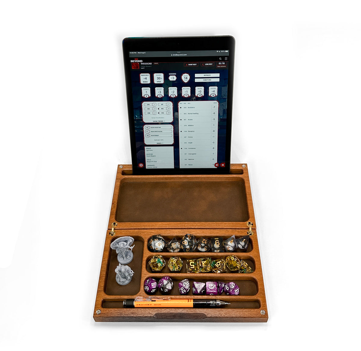 Wooden dice tray with dice and a tablet displaying a game interface on a white background